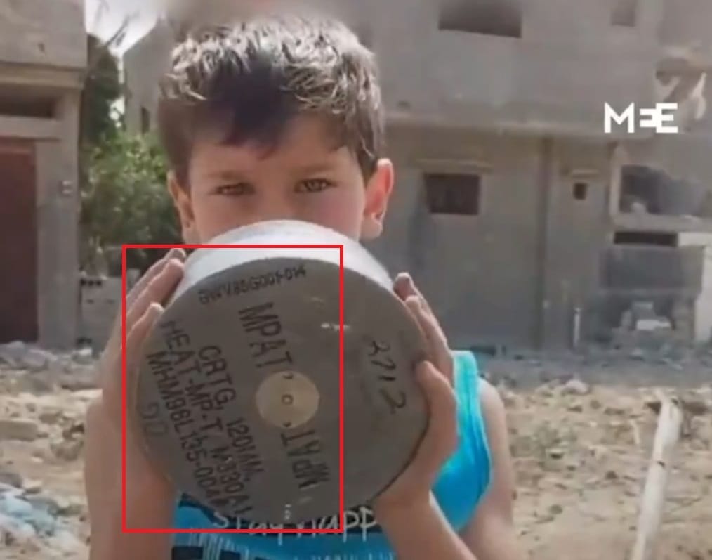This image from Gaza shows a fragment of a EO. From the writings on the fragment, we can decipher that it is a fired cartridge of a US 120mm M830A1 tank round. The lot number MHM96L135-00(?) indicates that this round was made at Iowa Army Ammunition Plant under Mason & Hanger, Silas Mason, INC in 1996. (Image Source: Middle East Eye)